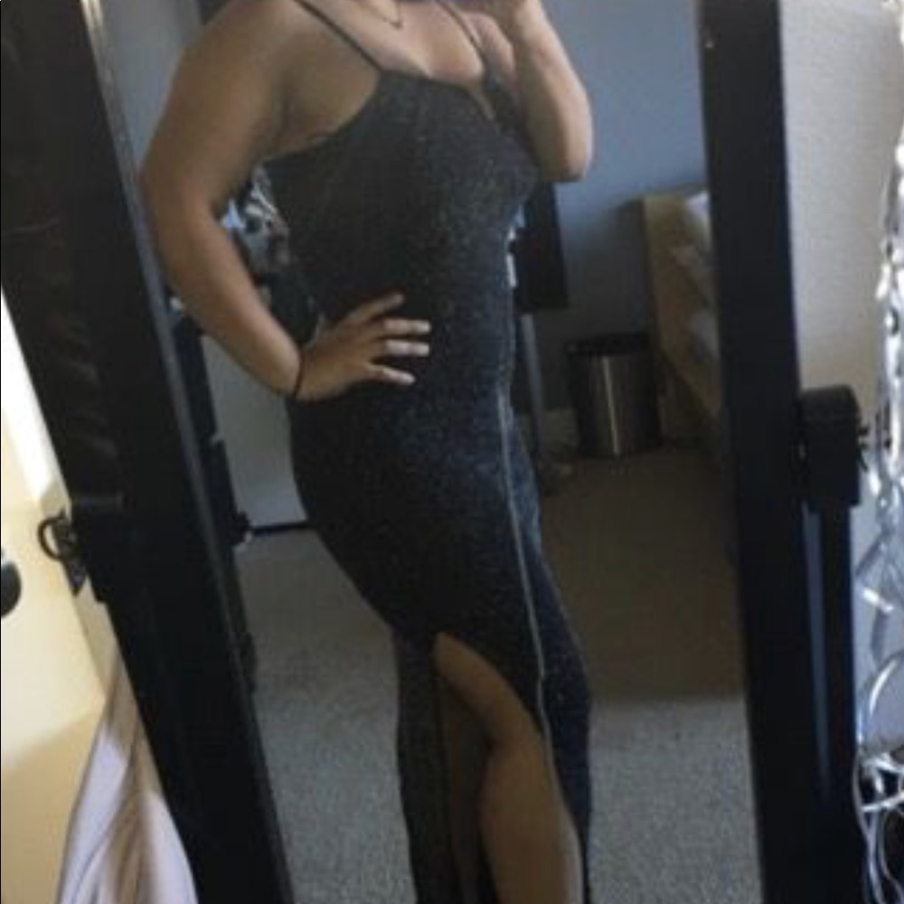 A black sparkly slit dress